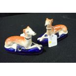 PAIR OF STAFFORDSHIRE POTTERY GREYHOUND INKWELLS