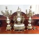 A 20TH CENTURY ITALIAN POLISHED BRASS AND CARRERA MARBLE CLOCK GARNITURE