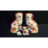 A PAIR OF STAFFORDSHIRE DOGS