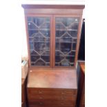 AN EDWARDIAN MAHOGANY BUREAU BOOKCASE