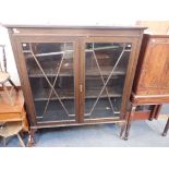 A 1920S GLAZED BOOKCASE