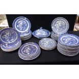 A LARGE QUANTITY OF VICTORIAN WILLOW PATTERN DINNER PLATES
