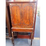 A 19TH CENTURY MAHOGANY CABINET ON STAND