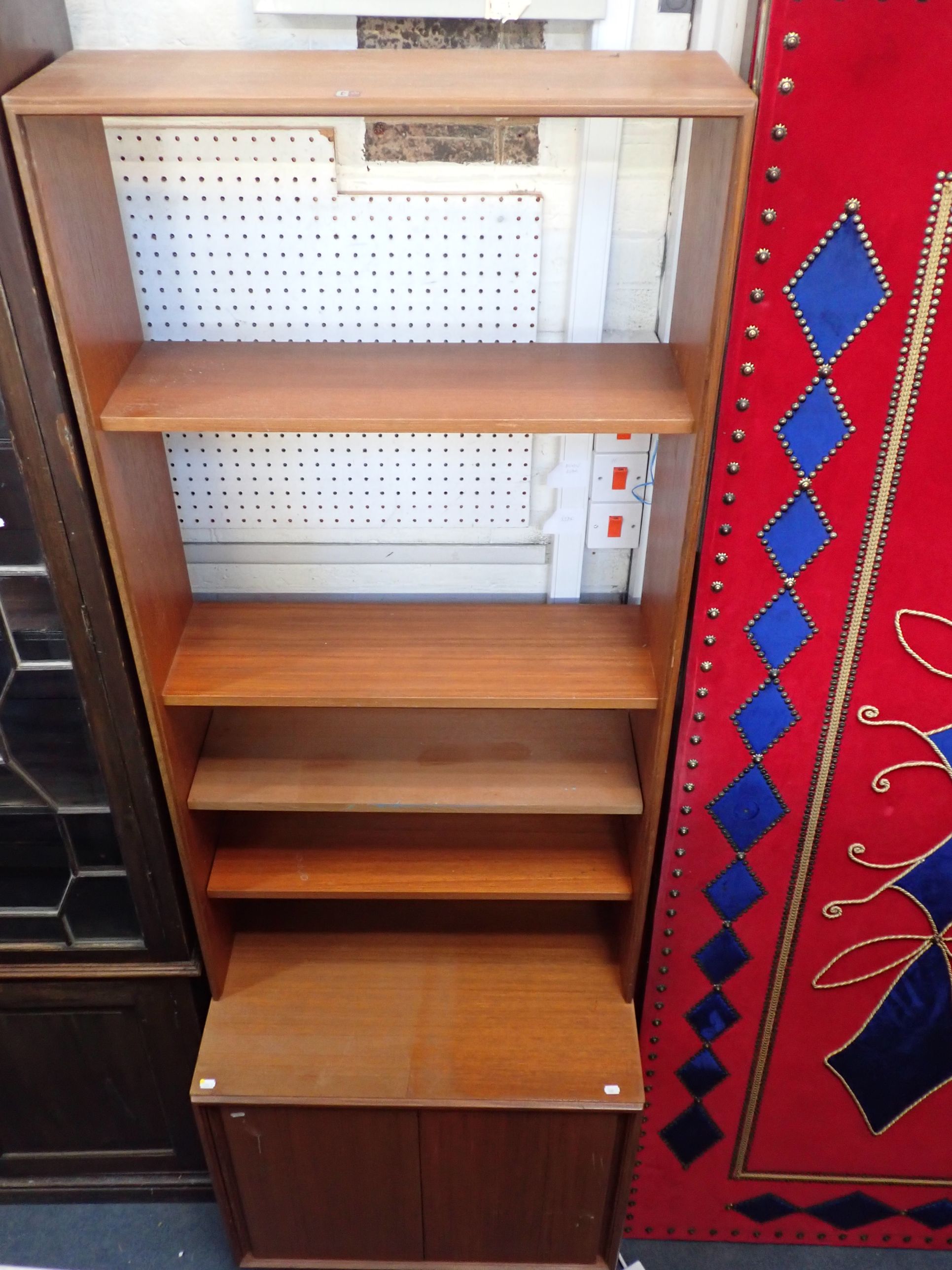 A MID-CENTURY MODERN TEAK OPEN BOOKCASE