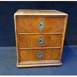 A VICTORIAN WALNUT THREE-DRAWER TABLE CABINET