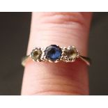 A 9CT GOLD SAPPHIRE AND SPINEL THREE STONE RING