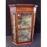 A SMALL EDWARDIAN GLAZED CORNER CABINET