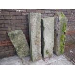 A GROUP OF FOUR STONE SLABS OR LINTELS