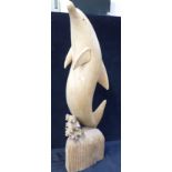 A CARVED WOODEN DOLPHIN