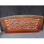 A CHINESE CARVED WOODEN PANEL