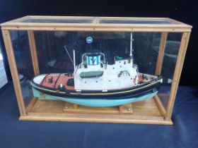 A CASED MODEL OF A TUG