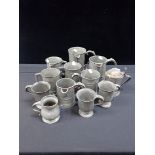 A COLLECTION OF PEWTER PUB TANKARDS