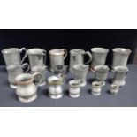 A COILLECTION OF PEWTER TANKARDS AND JUGS