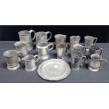 A COLLECTION OF PEWTER PUB TANKARDS AND MEASURES