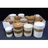 A COLLECTION OF STONEWARE STORAGE JARS CONTAINING OLD MEDICAL COMPOUNDS
