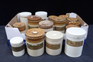 A COLLECTION OF STONEWARE STORAGE JARS CONTAINING OLD MEDICAL COMPOUNDS