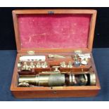 A 19TH CENTURY LACQUERED BRASS MONOCULAR 'STUDENTS' MICROSCOPE