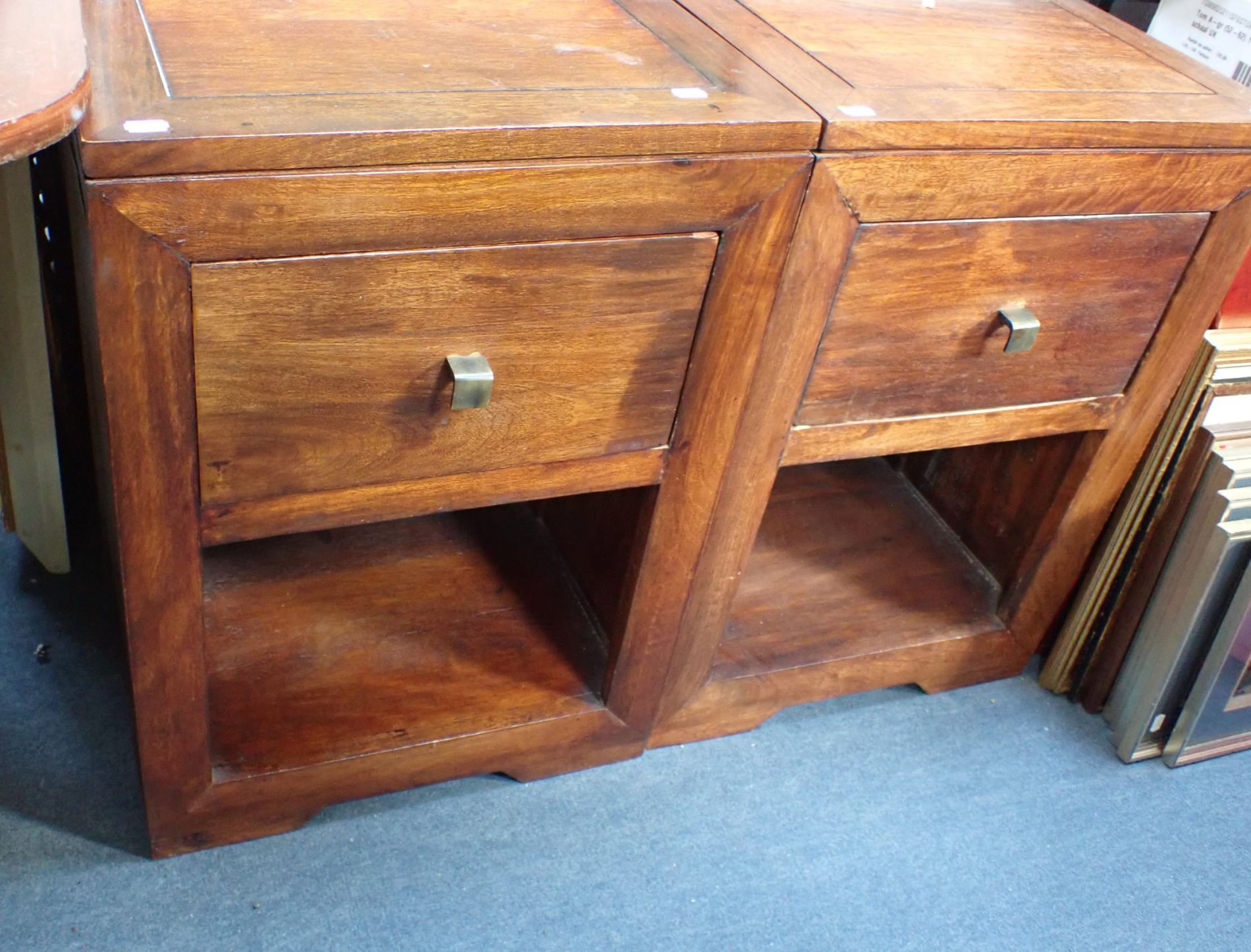 A PAIR OF HARDWOOD BEDSIDE CABINETS