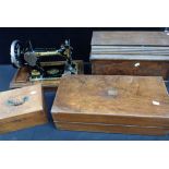 A VINTAGE SINGER SEWING MACHINE, OAK CASED