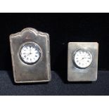 TWO SILVER CASED CLOCKS