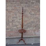 A 1920S MAHOGANY STANDARD LAMP