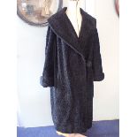 A LADIES VINTAGE FAUX ASTRAKHAN COAT