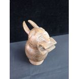 AN AFRICAN CARVED LIDDED VESSEL