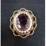 AN AMETHYST AND SEED PEARL 9CT GOLD BROOCH