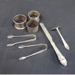 THREE SILVER NAPKIN RINGS AND OTHER ITEMS