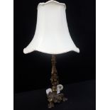 A GILT METAL ROCOCO STYLE TABLE LAMP