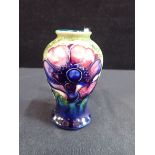 MOORCROFT: AN ANEMONE DECORATED SMALL BALUSTER VASE