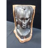 AN AFRICAN CARVED WOODEN HEAD