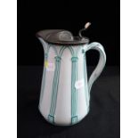 A VICTORIAN RELIEF MOULDED JUG, WITH PEWTER LID