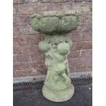 A RECONSTITUTED STONE BIRD BATH