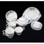 A PART TEA SET, HAND PAINTED AND GILT BY E.V. WHITAKER