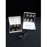 BOXED SETS OF WHITE METAL SPOONS