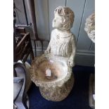 A RECONSTITUTED STONE BIRD BATH