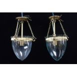A PAIR OF SMALL REGENCY STYLE BRASS AND GLASS HALL LANTERNS