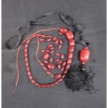 A 'CHERRY AMBER' STYLE GRADUATED BEAD NECKLACE