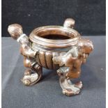 A BAROQUE STYLE BRONZE CENSER, SUPPORTED BY PUTTI