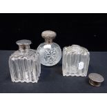 A PAIR OF SILVER-TOPPED DRESSING TABLE BOTTLES