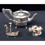 A SILVER TEAPOT