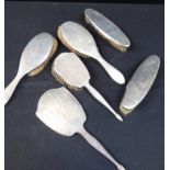 FIVE SILVER-BACKED BRUSHES AND A MIRROR