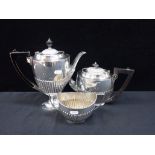 A MATCHED SILVER-PLATED THREE PIECE TEA SERVICE