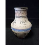 POOLE POTTERY: AN EARLY UNGLAZED CARTER'S VASE LATER DECORATED FOR THE 1964 OLYMPICS