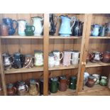 A COLLECTION OF VICTORIAN PEWTER-LIDDED JUGS