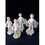 A PAIR OF 18TH CENTURY DUESBURY DERBY PORCELAIN FIGURES - STANDING PUTTI