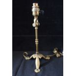 AN ARTS AND CRAFTS BRASS TABLE LAMP