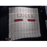 A GUCCI HEADSCARF, WITH ROSE DESIGN