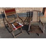 AN EDWARDIAN 'STEAMER' CHAIR, WITH CANE SEAT